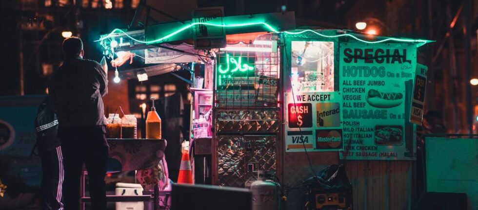 illuminated store on street at night